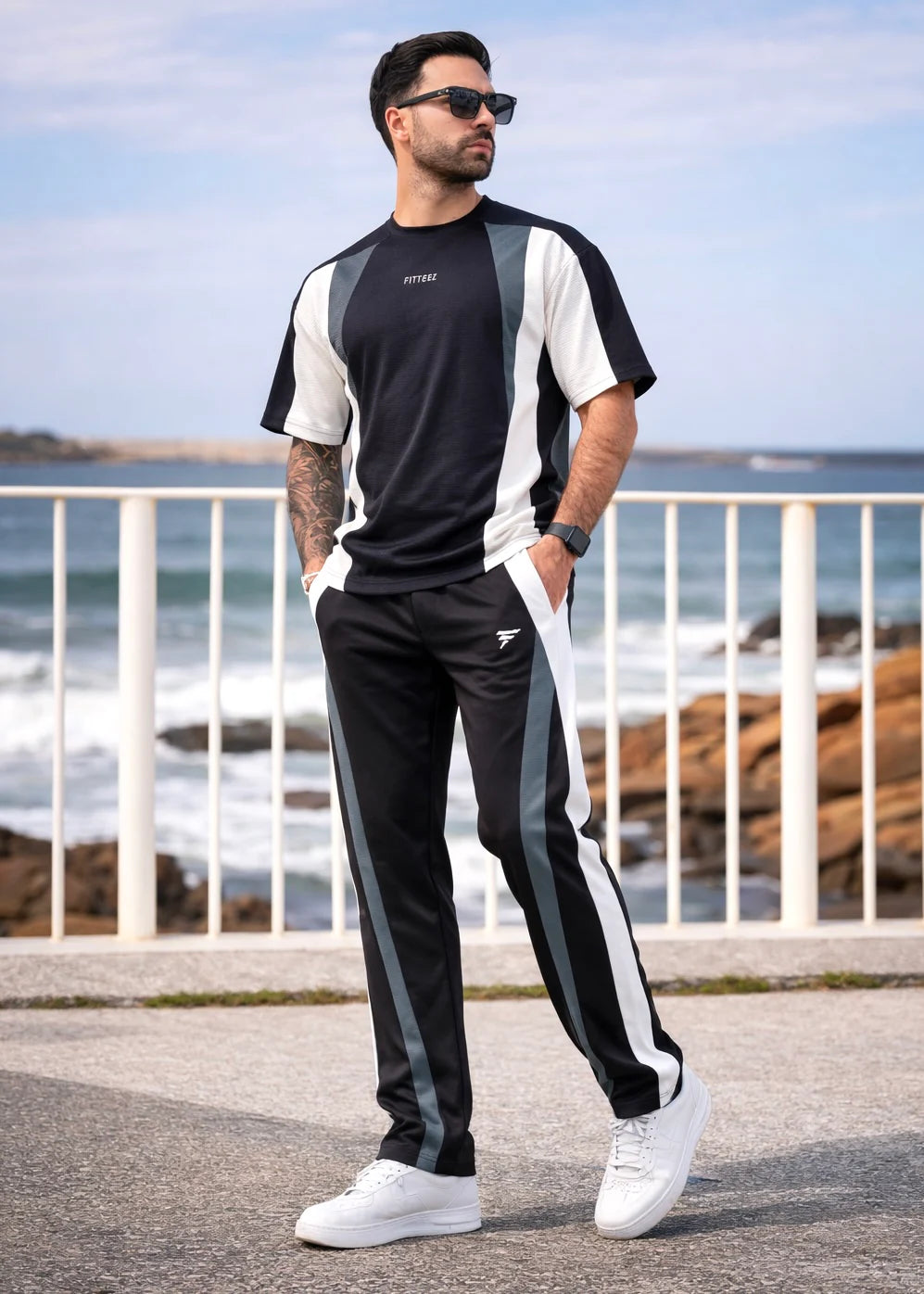 A short-sleeved crewneck t-shirt featuring a color-blocked panel design in black,