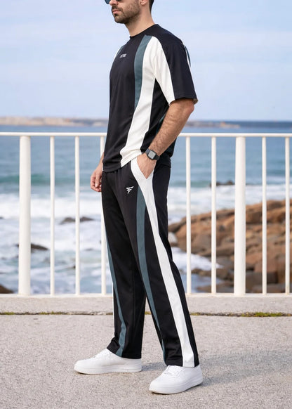 A short-sleeved crewneck t-shirt featuring a color-blocked panel design in black,