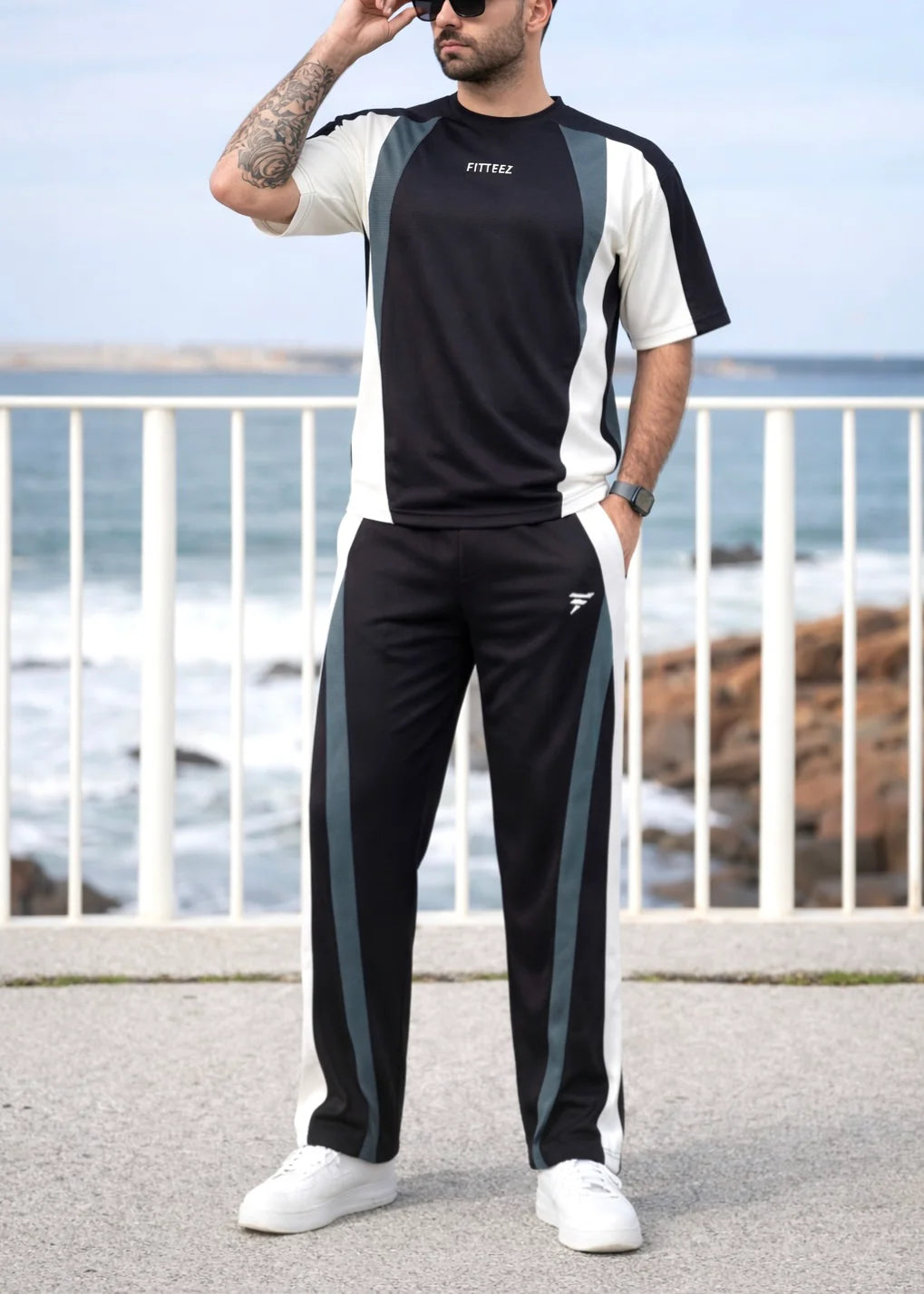 A short-sleeved crewneck t-shirt featuring a color-blocked panel design in black,