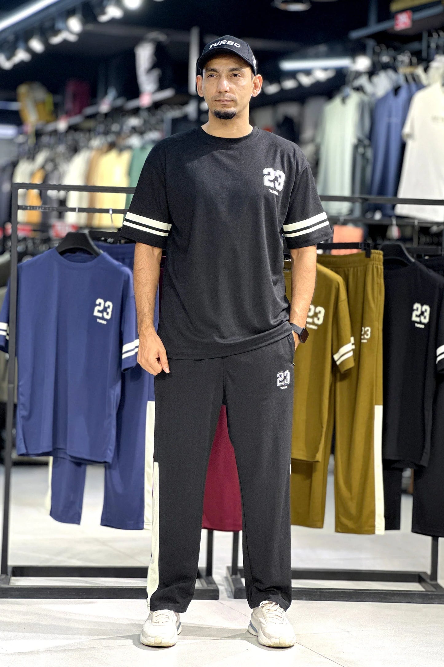 A short-sleeved crewneck t-shirt featuring a color-blocked panel design in black,