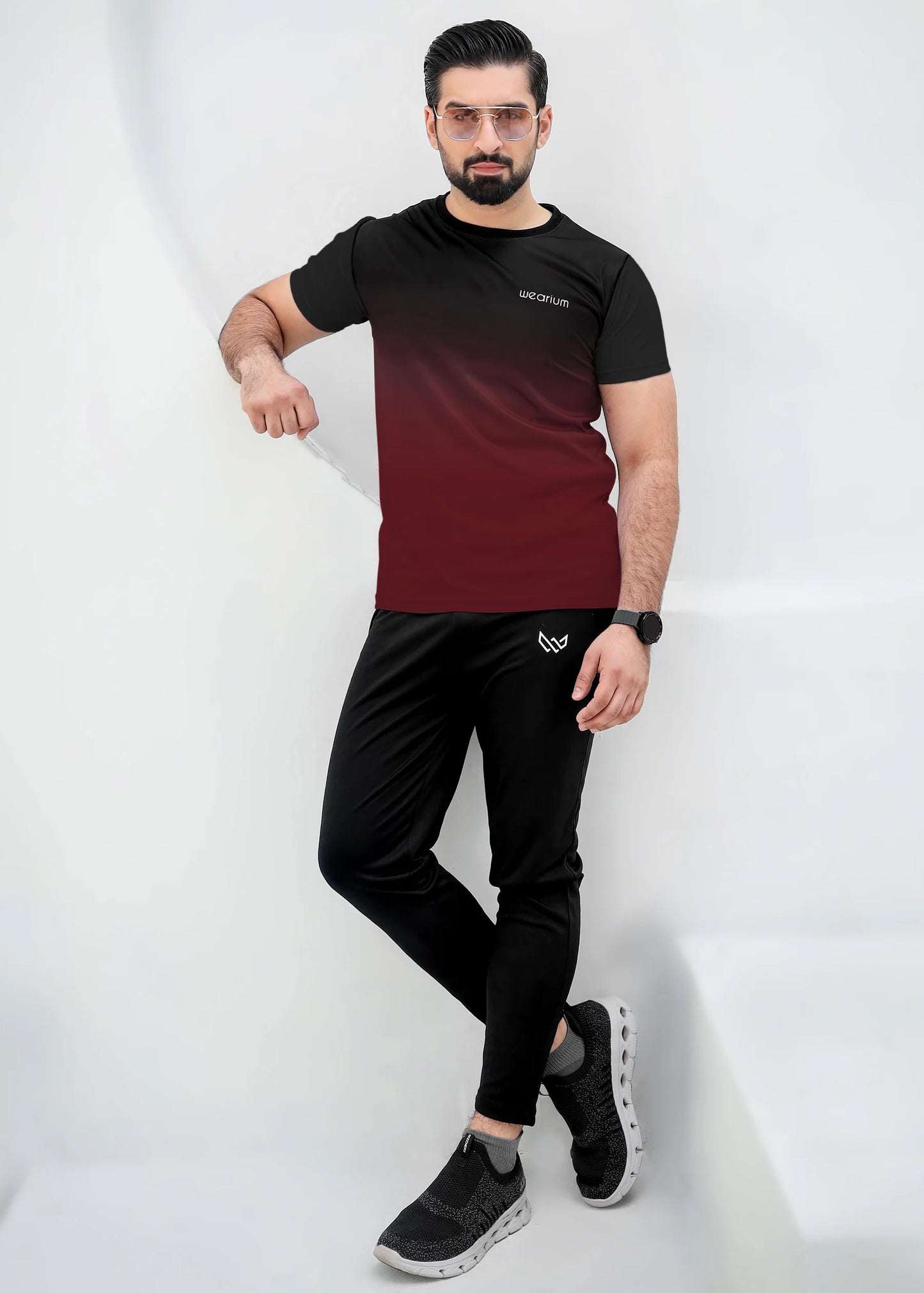 Top: A short-sleeved, crewneck t-shirt featuring a gradient (ombré) design that
