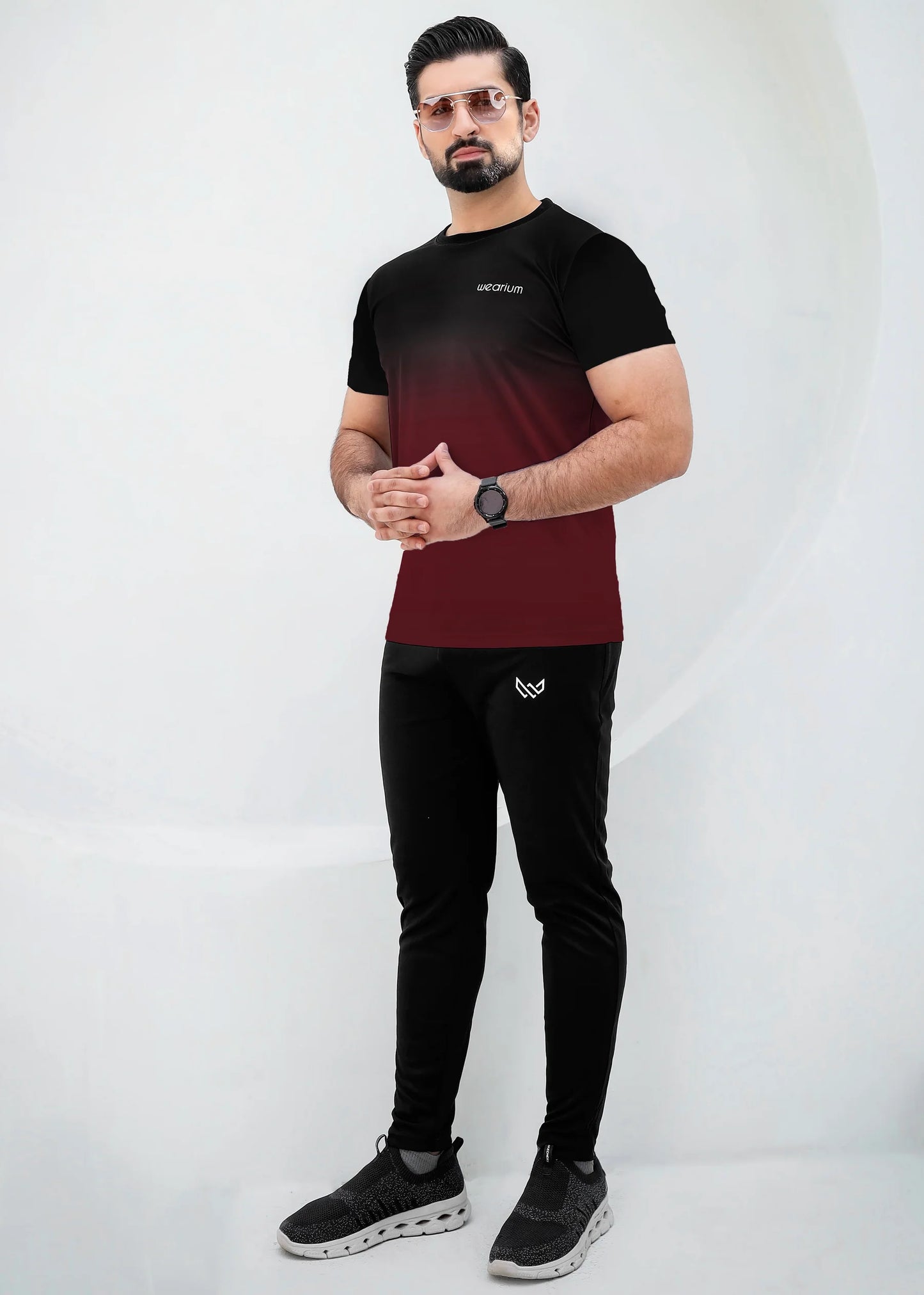 Top: A short-sleeved, crewneck t-shirt featuring a gradient (ombré) design that